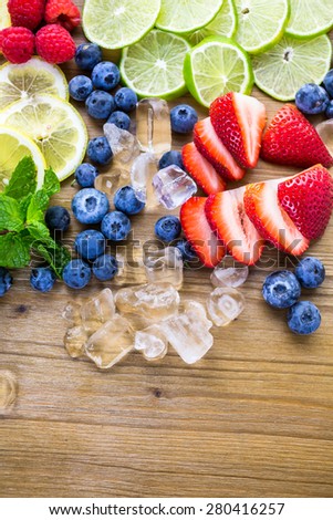 Sliced fresh organic fruits prepared to make infused water.