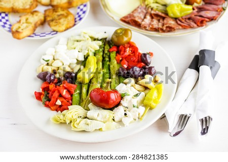 Appetizers plate with vegetarian antipasto in Italian restaurant.
