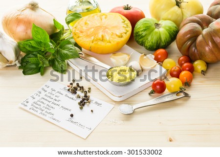 Ingredients to make roasted tomato soup with organic heirloom tomatoes.