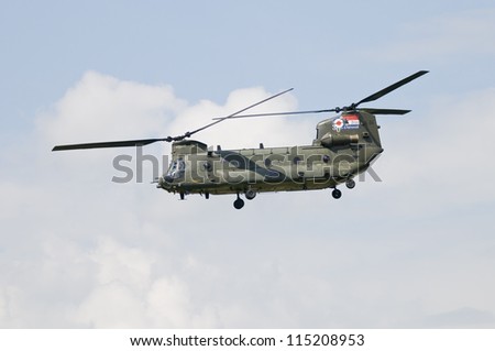 ROYAL INTERNATIONAL AIR TATTOO, FAIRFORD, UK - JULY 08: Boeing CH-47 Chinook military transport helicopter performing display at the Royal International Air Tattoo, RAF Fairford, July 08, 2012.