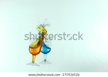 Dancing lasses with colorful liquors making liquor splash