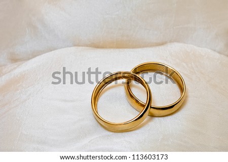 Close up of two wedding rings as a symbol of marriage