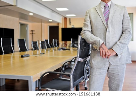 Bust of an anonymous businessman in a meeting room as a business concept