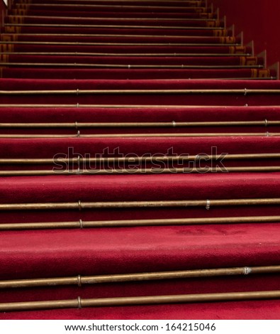 Red stair carpet, concept of overcoming obstacles and progression