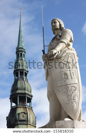 The statue of Roland and the Church of St. Peter in Riga, Latvia. The statue of Roland - monument knight with a naked sword (sword of justice), a symbol of freedom of the medieval city.