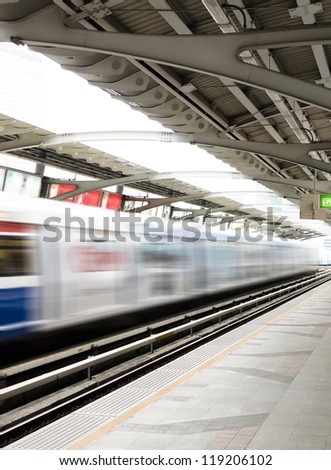 Rapid train moving from platform , blurred motion