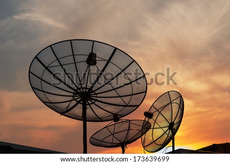 Antenna communication satellite dish over sunset sky