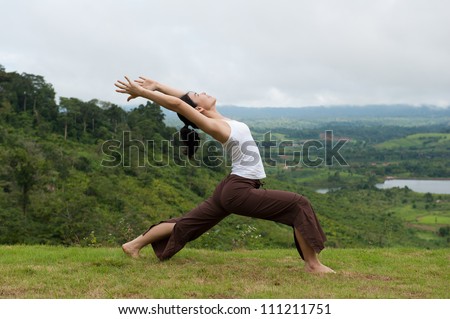 Asian women do Yoga with mountain view, High Lunge