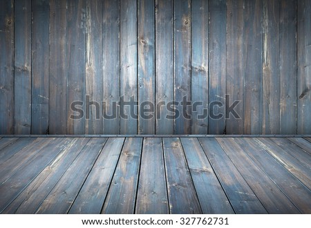 Blue painted wood table with dark wall background