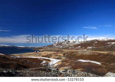 Landscape with houses in the north of Norway in may month