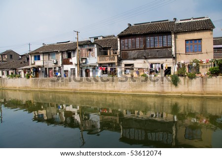 Grand Canal in Wuxi, China. The Grand Canal is the longest canal or artificial river in the world.