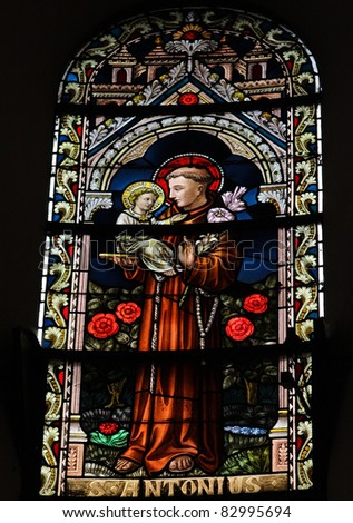 Saint Antonius or Saint Anthony, stained glass window in the cathedral of Spa, Belgium,.
