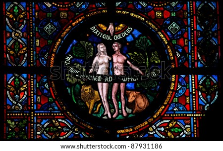 Creation of Adam and Eve, stained glass window in the church of Dinant, Belgium.