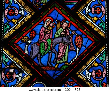 BAYEUX - FEBRUARY 12: Stained glass window depicting  the Holy Family in Bethlehem, in the cathedral of Bayeux, Normandy, France on February 12, 2013.