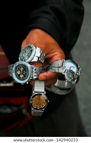 Shanghai, China - October 28: A Chinese Salesman Shows His Merchandise Of Fake Designer Watches On The Bund In Shanghai, On October 28, 2007.