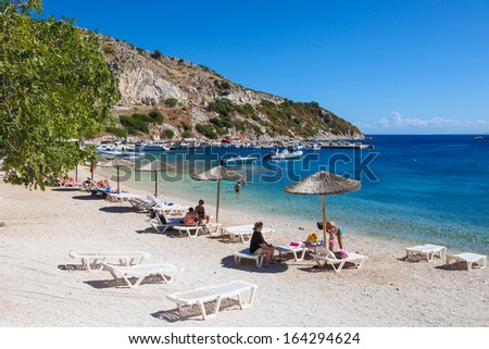 ZAKYNTHOS, GREECE - SEPT 21: Unidentified tourists at a beach in Zakynthos, Ionian islands, Greece, on September 21, 2013.
