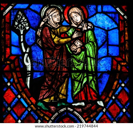TOURS, FRANCE - AUGUST 8, 2014: Stained glass window depicting the Visitation, the visit of the Blessed Virgin Mary to her niece Elisabeth in the Cathedral of Tours, France.