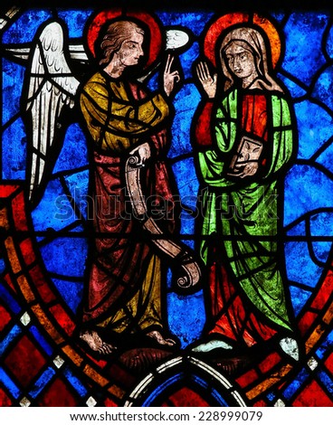 TOURS, FRANCE - AUGUST 14, 2014: Stained glass window depicting the Annunciatio, the visit of Archangel Gabriel to the Blessed Virgin Mary in the Cathedral of Tours, France.