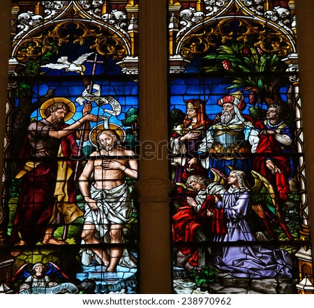 BURGOS SPAIN AUGUST 13 2014 Stained glass window depicting the Baptism of Jesus by Saint John in the cathedral of Burgos Castille Spain BURGOS SPAIN AUGUST 13 2014 Stained glass window depicting the Baptism of Jesus by Saint John in the cathedral of Burgos Castille Spain