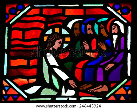 AMIENS, FRANCE - FEBRUARY 9, 2013: Stained glass window depicting Jesus washing the feet of the apostle Peter at the Last Supper on Maundy Thursday, in the Cathedral of Our Lady of Amiens, France.