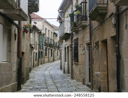 Narrow street in the old center of Tui, a border town with Portugal in the region of Galicia, Spain.