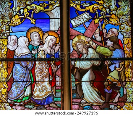 MECHELEN, BELGIUM - JANUARY 31, 2015: Stained Glass window depicting Jesus and Mary on the Via Dolorosa, in the Cathedral of Saint Rumboldt in Mechelen, Belgium.
