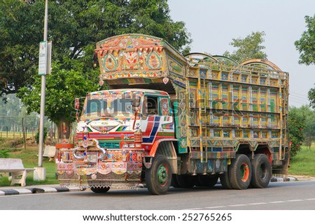 JAIPUR, INDIA - SEPTEMBER 27, 2008: Colorful Indian truck on a highway near Jaipur, Rajasthan, India