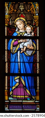 BRUSSELS, BELGIUM - JULY 26, 2012: Stained Glass window depicting Mother Mary and the Child Jesus, in the Cathedral of Brussels, Belgium.