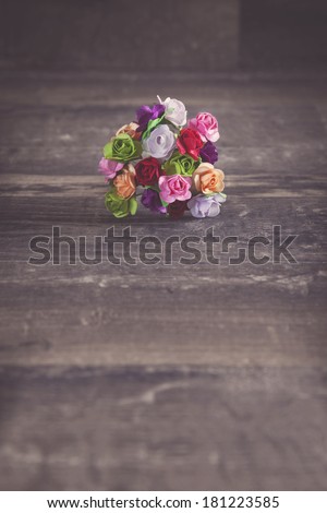 Flower bucket on wood background with a filtered look