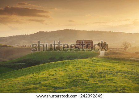Warm sunset light over a property from Tuscany