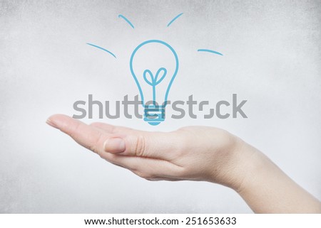 Hand with light bulb. Concept for creativity and ideas