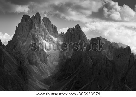 Dramatic light in Dolomites Mountains. Black and white landscape