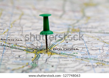 push pin pointing at Bologna, Italy