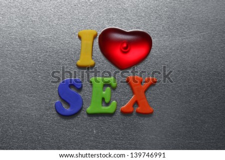 i love sex spelled out using colored fridge magnet