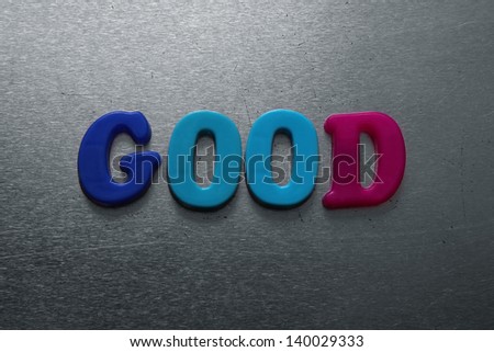 word good spelled out using colored fridge magnets