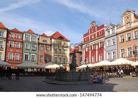 POZNAN - JULY 19: Colorful architecture and fountain at Old Market Square in Poznan; on July 19, 2013 in Poznan, Poland. The city is the 4th largest and the 3rd most visited city in Poland.