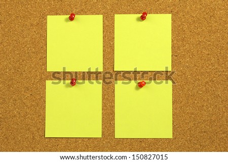 yellow blank note card on a cork board
