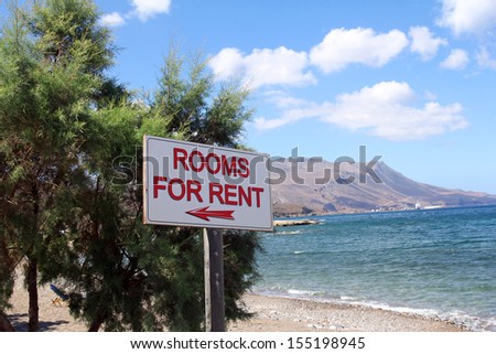 rooms for rent sign on beautiful beach