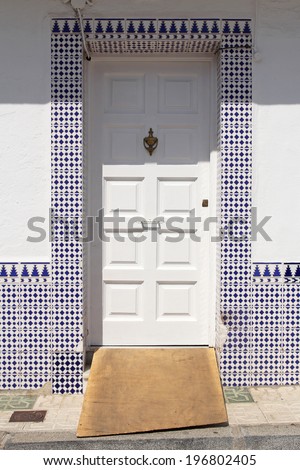 white door with spanish azulejos