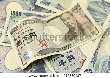 selective focus on heap of japanese yen banknotes