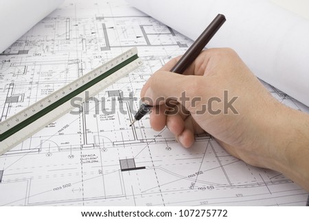Male hand with pen in drawing