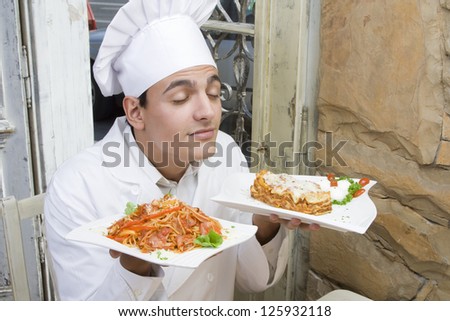 Chef enjoys the smell of spaghetti and lasagna