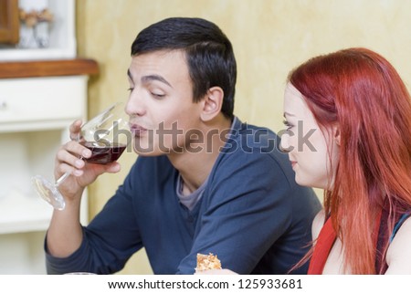 Spontaneous scene from restaurant - Young couple at the restaurant