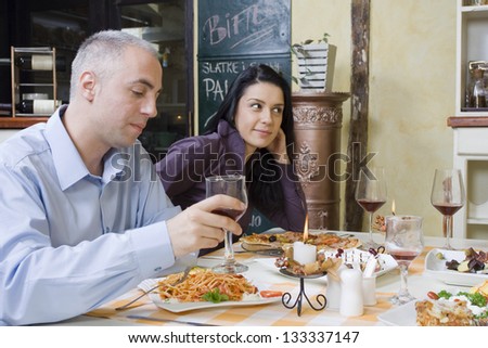 Spontaneous scene from a restaurant - Young couple at the restaurant - Selective focus