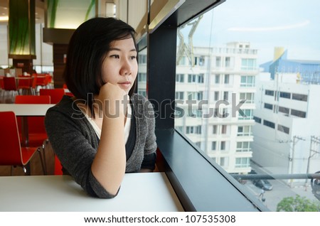 Young woman relaxing in restaurant