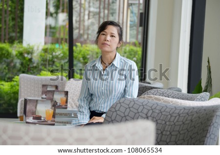 A Woman relaxing in restaurant