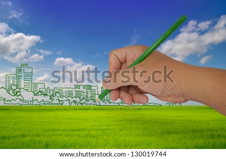 hand drawing city on field - green city concept