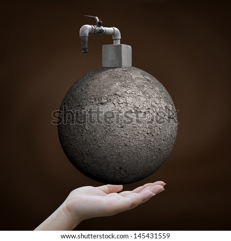save water concept, hand holding arid world with faucet