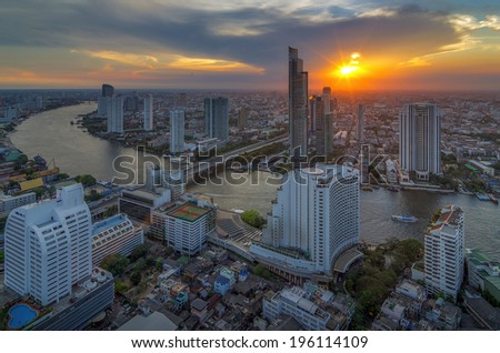 Landscape modern building near the river at sunset in Bangkok view of the bird.