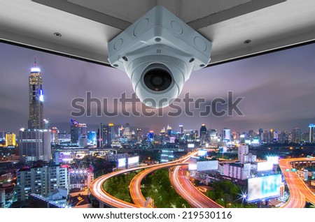 The security cameras on a balcony high building. CCTV view traffic at twilight